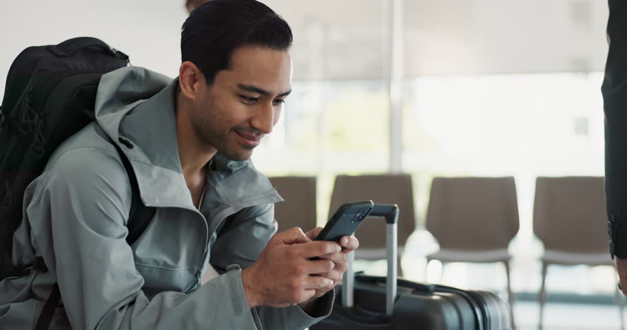 Airport, man and phone text with travel, smile and social media break with internet scroll. Happy, networking and bag for vacation or trip with message and technology at boarding waiting room