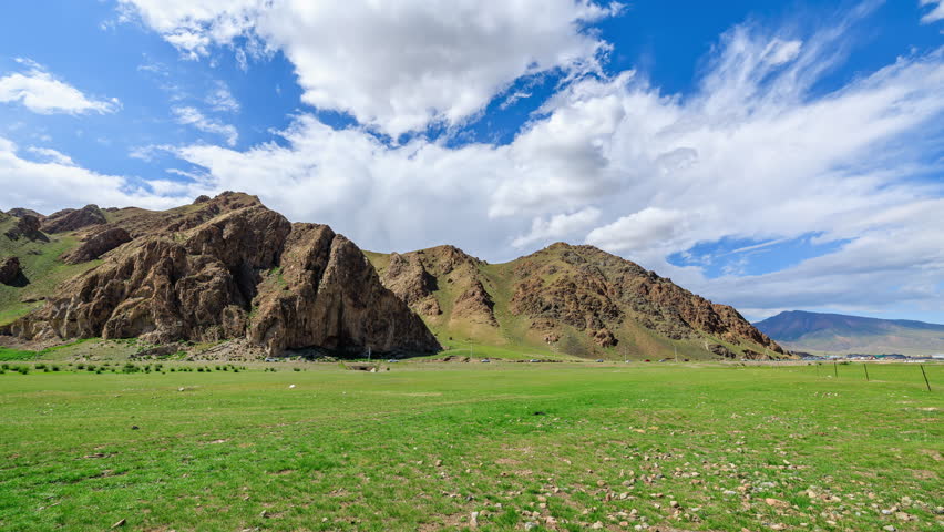 Green grass with mountain natural landscape in summer. road trip.