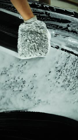 Hand scrubbing car with foam mitt