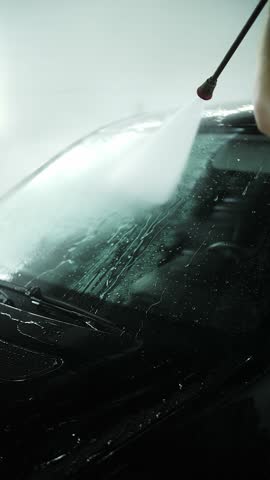 Car rinsed with high-pressure water