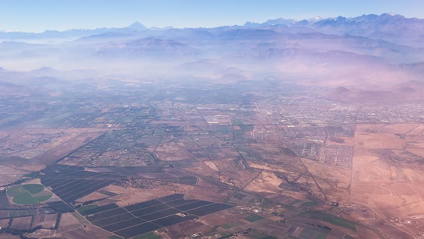 Flying over rural areas of Santiago de Chile in an airplane at the end of summer before the first rains.