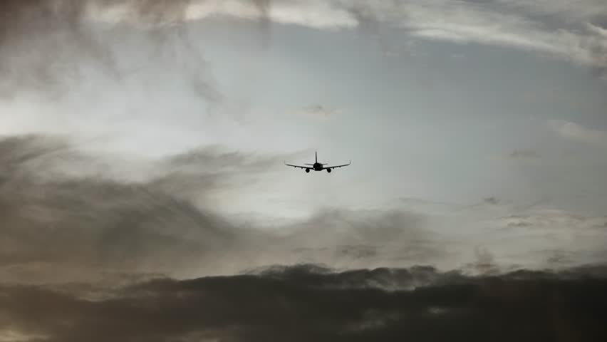 The plane flies in the cloudy sky. Concept of travel and air travel.