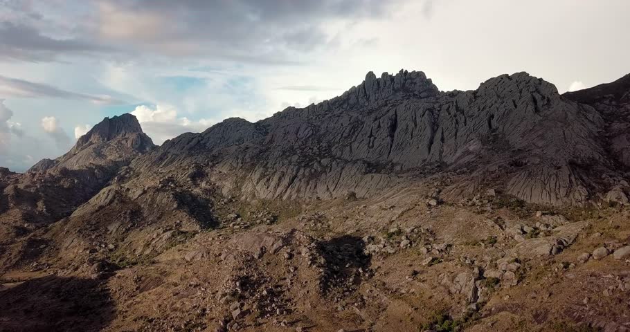 Andringitra national park,mountain landscape. View from above. Top drone video of sunset mountain panorama and valley with dramatic sky. Madagascar hill wilderness.