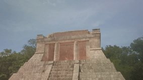 Gimbal booming down shot of the North Temple or Temple of the Bearded Man at the Great Mayan Ball Court in Chichen Itza, Mexico. 4K - Powered by Shutterstock - Get 15% off with code: PIKWIZARD15
