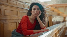 Sad boring tired exhausted Caucasian girl student Hispanic woman Latina lady American female sitting in university college auditorium bored lesson lecture study overworked falling asleep sleep napping - Powered by Shutterstock - Get 15% off with code: PIKWIZARD15