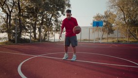 Focused black sportsman bounces ball improving technique for basketball game at outdoor court. Experienced man player shows skills training on weekend - Powered by Shutterstock - Get 15% off with code: PIKWIZARD15