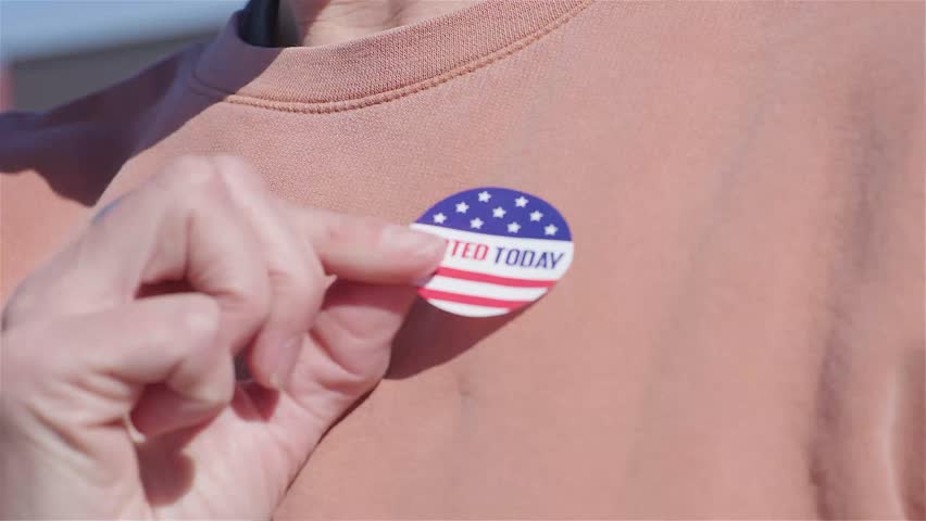 I vote today stickers roll in US elections on American flag