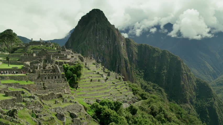 Time lapse view of mysterious Machu Picchu Inca ruins shrouded in mist high in the Andes mountains, Cusco Region, Urubamba, Peru.