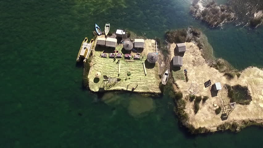 Aerial view of Uros Floating Islands (Spanish: Islas Uros ) on Lake Titicaca, the highest navigable lake in the world, on the border of Peru and Bolivia, South America.