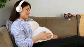pregnant woman listening music with headset - Powered by Shutterstock - Get 15% off with code: PIKWIZARD15