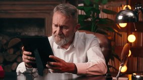 Sad Caucasian old man elderly male pensioner grandfather looking photo photography past nostalgia aging regret memories grief businessman loss pain alone home business retirement memory time inside - Powered by Shutterstock - Get 15% off with code: PIKWIZARD15