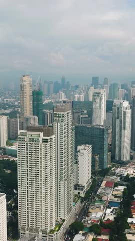Business buildings and high rise condominiums. Makati Skyline. Metro Manila Cityscape. Philippines. Vertical view.