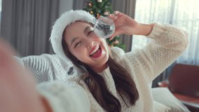 Happy young asian woman selfie video call online with friends and show Christmas balls on mobile phone in living room decorate Christmas tree at home, Merry Christmas and Happy New Year! - Powered by Shutterstock - Get 15% off with code: PIKWIZARD15