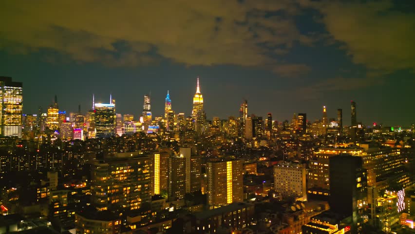 New York City Skyline at dusk night aerial view. NYC near night from drone. New York City skyline, cityscape with skyscrapers of Manhattan. Panoramic aerial view on Manhattan at night. Travel in USA.