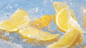 Fresh organic orange slices splashing into water in slow motion 300fps - Powered by Shutterstock - Get 15% off with code: PIKWIZARD15