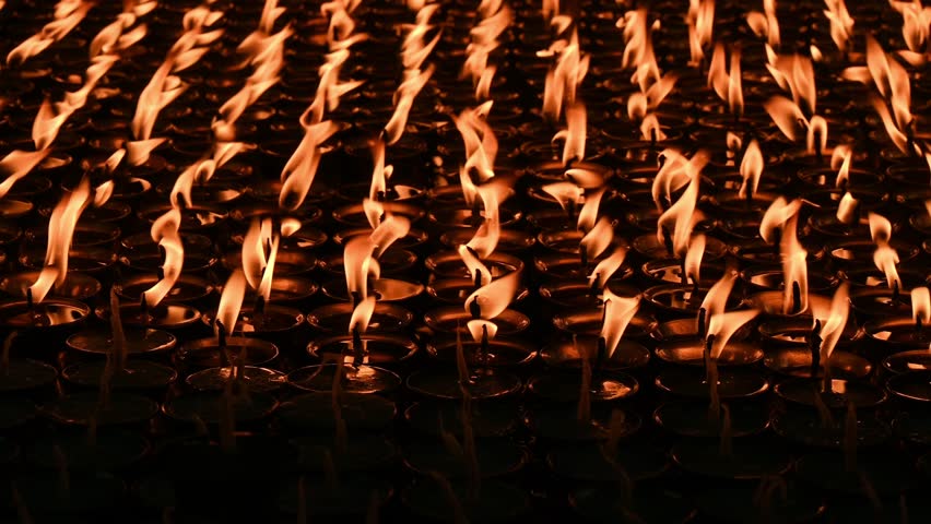 Light candles in Swayambhunath temple, Nepal. The faithful also light candles as a sign of gratitude to God for answered prayers.