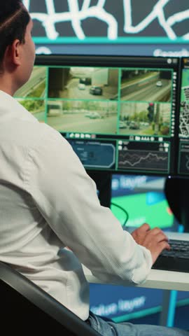 Vertical Video Team of employees monitoring delivery trucks with gps coordinates on satellite navigation, tracking orders with awb shipping system. Operators working in control center. Camera A.