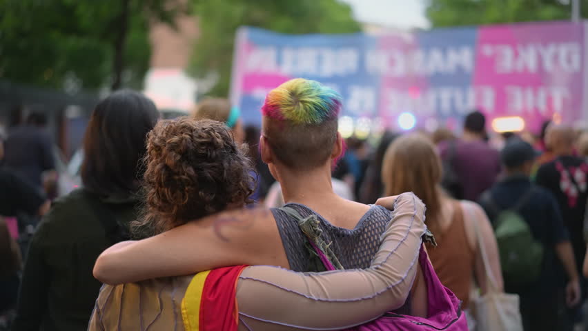 Happy lesbian couple walk lgbt pride. Two bi girl lovers go csd fest. Free same sex people coming out gay party. Dressed up love women. No stop homophobia. Lesbian community march. Rainbow lgbtq flag.