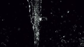 An elegant slow-motion water splash creates mesmerizing droplets, surrounded by shimmering bokeh lights that enhance its serene and artistic ambiance - Powered by Shutterstock - Get 15% off with code: PIKWIZARD15