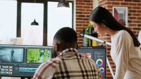 Diverse mixed race couple working as a team for a freelance video shoot, editing and mixing video clips in post production using modern software. Multiethnic people do remote work. Camera B. - Powered by Shutterstock - Get 15% off with code: PIKWIZARD15