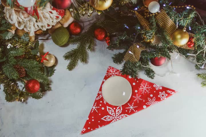 New Year timelapse. against the background of Christmas decor, a tangerine, two champagne glasses and sparklers appear. The concept of a happy new year and Merry Christmas.