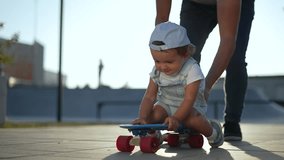 Father teaching son to skateboard. Father supports son on skateboard. Happy child learning skateboard with dad's help. Father and son bonding outdoors. Father, son, skateboard, roller adventure. - Powered by Shutterstock - Get 15% off with code: PIKWIZARD15