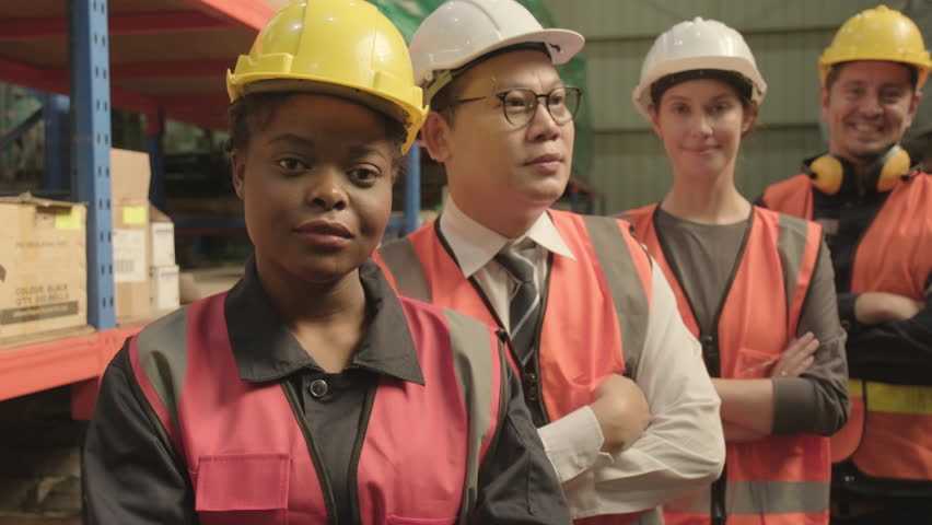 Protrait of multiracial colleagues worker standing and thump up  in the industrial factory