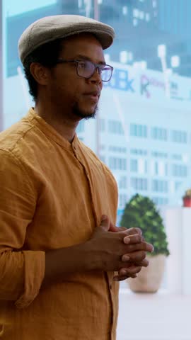 Vertical Video Business woman meeting with realtor to review blueprints for high class office relocation. Entrepreneur negotiating contract deal for rental agreement, plans to invest in property