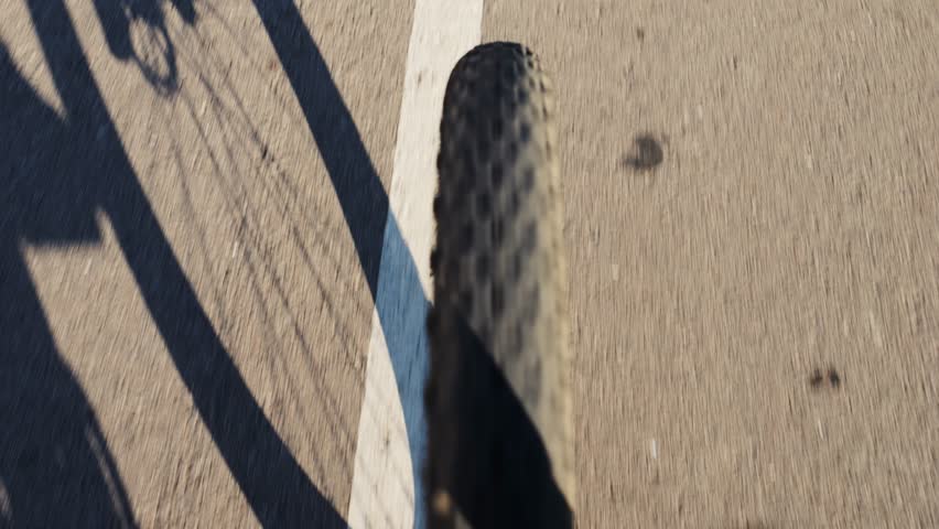 Pov riding bicycle bike, point of view closeup of a hand on a bicycle handle a sunny day, highlighting the joy of cycling in spain, barcelona
