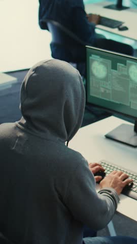 Vertical Video Cyber security specialist conducting cyber surveillance and threat detection in a governmental agency. Professional hackers team managing cybercrime prevention and malware detection
