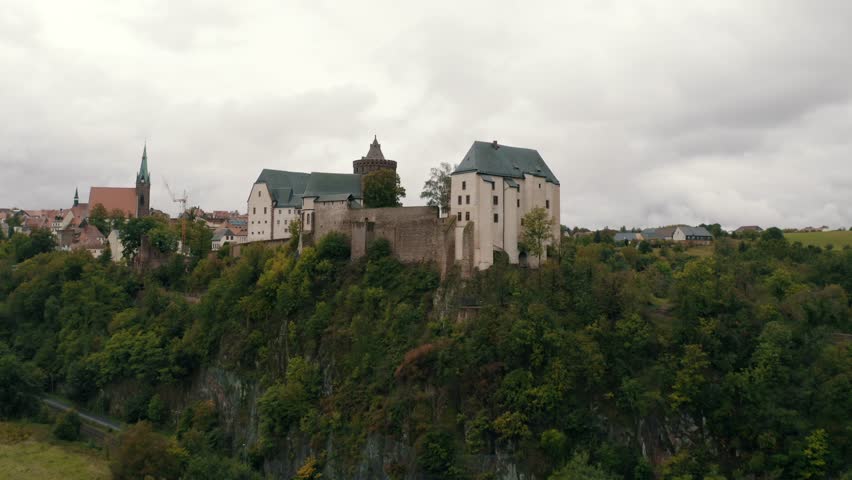 Mildenstein Castle, a medieval hilltop fortress in Saxony near Chemnitz, Dresden, dates back to the 10th century. Known for its historic architecture, towers, and exhibitions, it