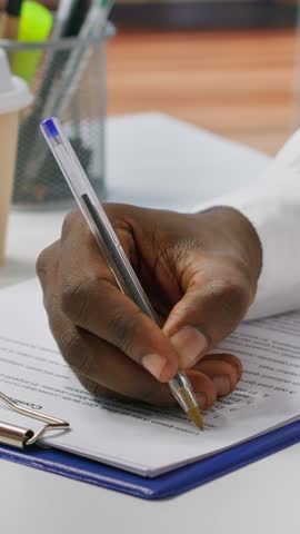 Vertical Video Job candidate signing his work contract and securing a corporate position, reading the employment agreement terms. Businessman applicant finding a new job within company. Close up
