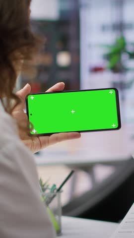 Vertical Video HR team selecting candidates and using a copy space mockup display in high end office, working on finding the best applicant for the job opening. Recruiters review resumes. Camera A.