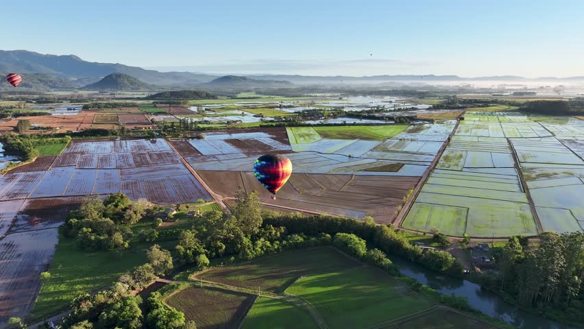 Colorful Balloon At Praia Grande Santa Catarina Brazil. Colorful Hot Air Balloon Flying Over Beautiful Green Landscape. Sunset Exotic Valley Mound Awesome. Countryside. Praia Grande Santa Catarina.