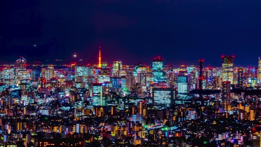 Tokyo night view time lapse close-up of skyscrapers

