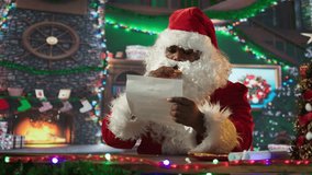 Santa Claus in red suit opening envelopes with letters from children, fulfilling wishes for kids at cozy North Pole log cabin. Winter season celebration to spread the Christmas spirit. Camera B. - Powered by Shutterstock - Get 15% off with code: PIKWIZARD15