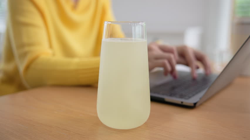 Happy fresh asia people young adult woman take skin care detox pill folic iron drinking diet zinc vit c d boost water for worker enjoy relax work at home desk. Herbal juice glass refresh immune system