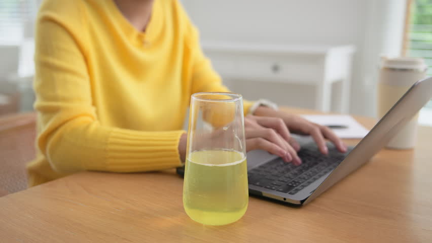 Happy fresh asia people young adult woman take skin care detox pill folic iron drinking diet zinc vit c d boost water for worker enjoy relax work at home desk. Herbal juice glass refresh immune system