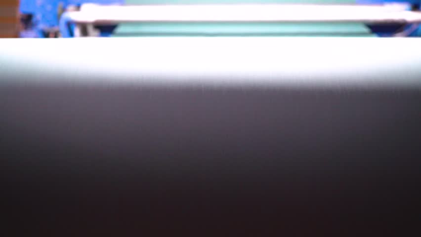 Close-up view of machinery at work in a textile factory from a good angle