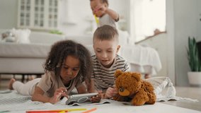 Happy five-year-old children playing video games in smartphone, portrait at home . African American girl and Caucasian boy looking at display, kids and internet technology, online games in mobile app - Powered by Shutterstock - Get 15% off with code: PIKWIZARD15