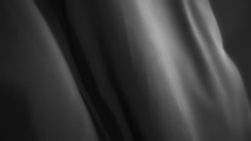 Silky gray fabric waving in the wind. Abstract texture background. Slow motion. 