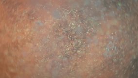 Teal and orange glitter particles exploding in slow motion.  - Powered by Shutterstock - Get 15% off with code: PIKWIZARD15