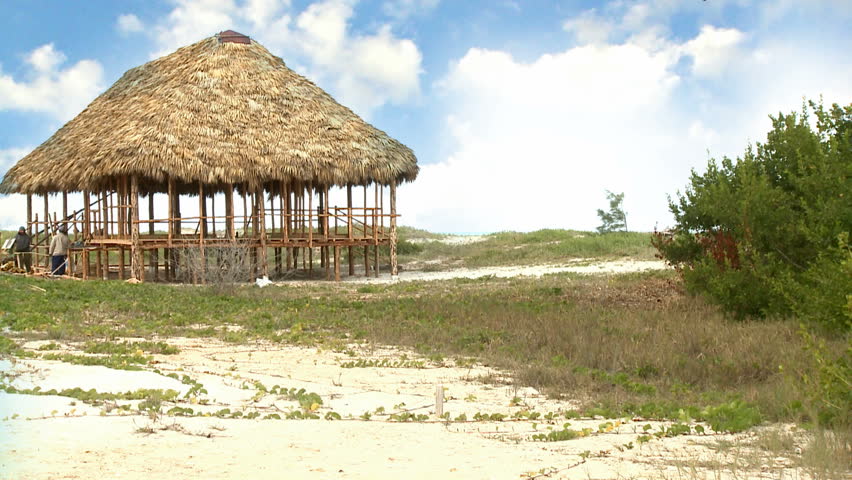 Man walking by on a beach in Cuba