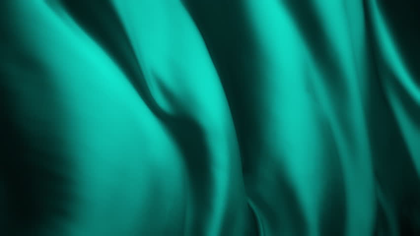 Wavy teal colored chiffon fabric flowing in the wind. Abstract texture background. Slow motion. 