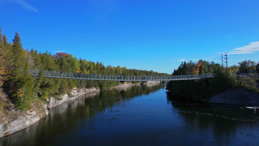 Aerial view from above at Ranney Gorge Suspension Bridge in Campbellford, part of the Great Trail. Longest recreational trail in the world. Trent River below and Ranney Falls to the north. Ferris Park