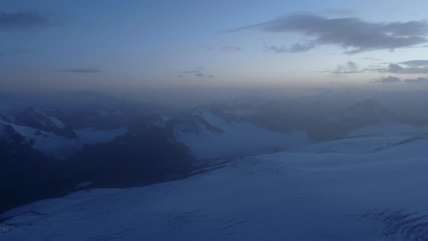 beautiful snowy evening on mount elbrus, drone view