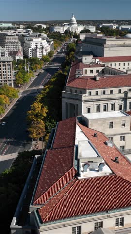 Vertical Video aerial view of US Capitol and Washington DC looking down Pennsylvania Avenue with buildings, streets and traffic.