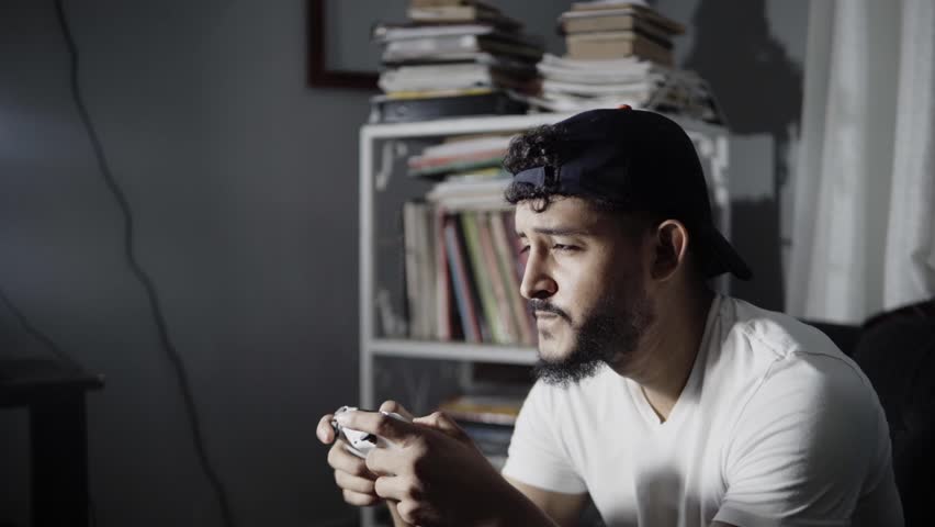 Man fron a TV playing a videogame