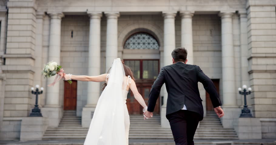 Back, people and wedding day with love, talking and smile for ceremony, marriage or commitment. Happy couple, celebration and excited for care, partnership or bonding as playful for reception in city