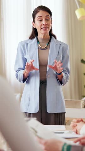 Office, businesswoman and presentation with discussion for training, sales strategy and teaching. Workplace, female speaker and employees with information for corporate project, feedback and workshop